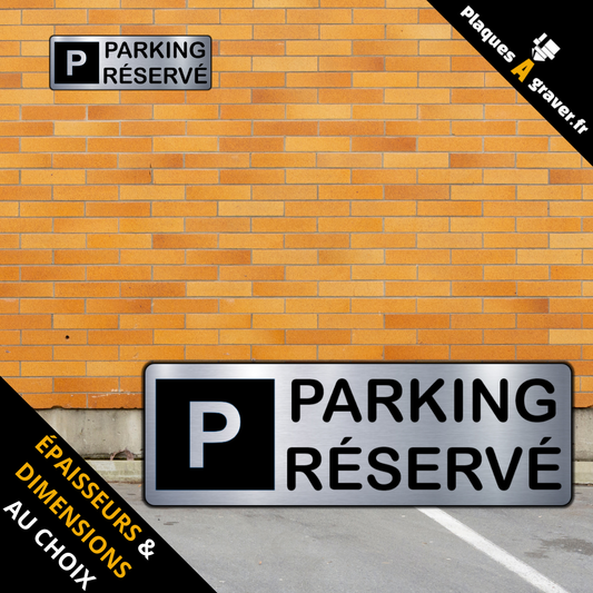 plaque Parking réservé en PVC adhésive Plaques à Graver installée sur une place de stationnement